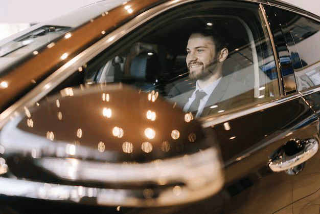 smiling confident bearded businessman wearing business suit sitting wheel new car 482921 1259