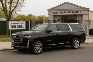 Ohel Chabad Lubavitch Car Service 1 Luxury car parked outside Ohel Chabad Lubavitch in Queens, NYC, ready for premium chauffeur service by Gotham Ride