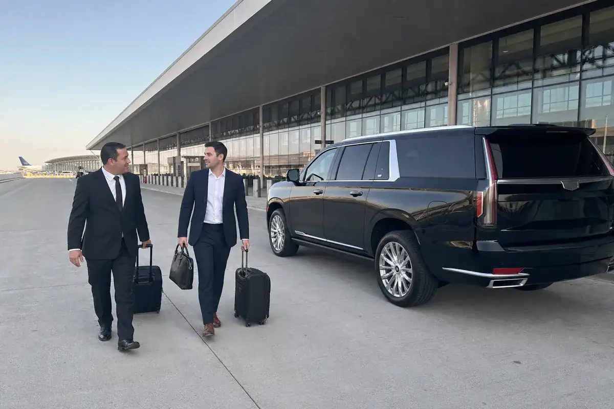 Car service from Harrison to JFK Airport with a black SUV at the terminal