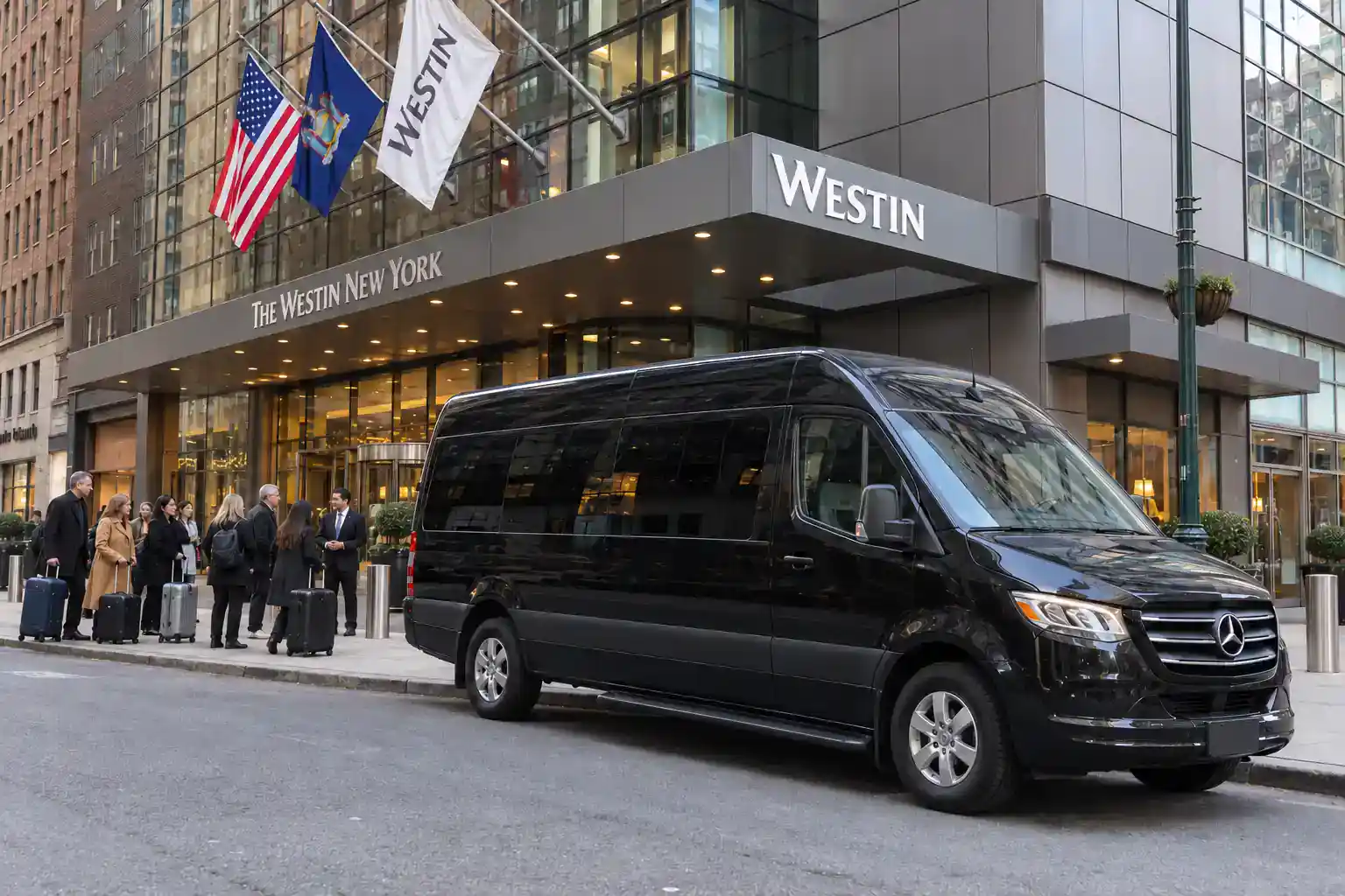 JFK to Times Square: How Far It Is, What It Costs and the Best Way There (2026) 6 Group of travelers arriving from JFK by black Sprinter van at a hotel near Times Square